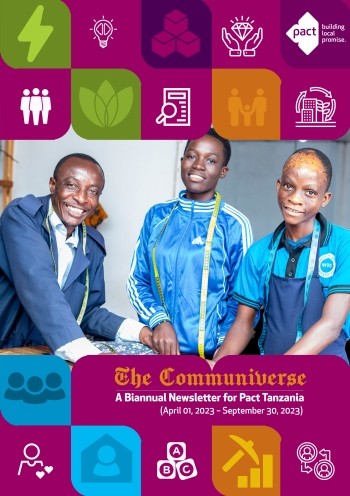 Three people wearing blue stand looking at the camera and smiling. Text on the cover reads "The Communiverse: A Biannual Newsletter for Pact Tanzania, April 1, 2023 - September 30, 2023".