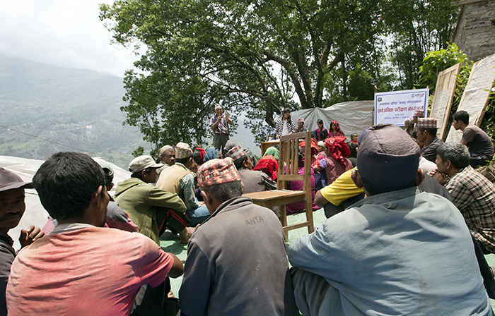 Citizens gather in rural Nepal before the pandemic to learn about local public improvement projects, including project budgets. (Photo: Brian Clark/Pact)